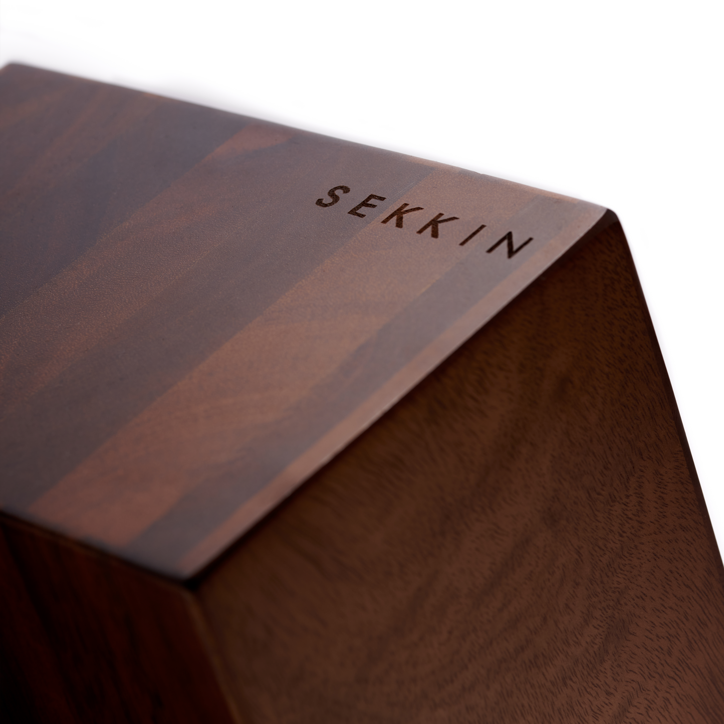 Wooden block with 'SEKKN' branding on a white background