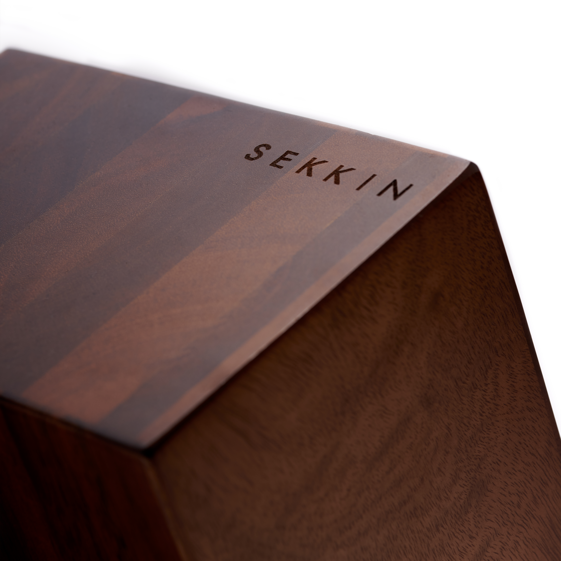 Wooden block with 'SEKKN' branding on a white background