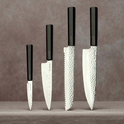 Full knife set on pink background