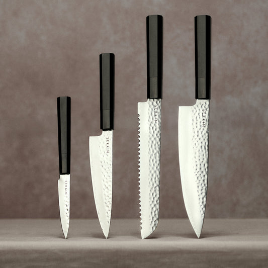 Full knife set on pink background