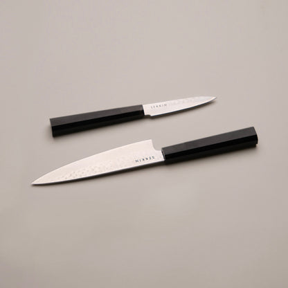 Two SEKKIN Knives on a white surface